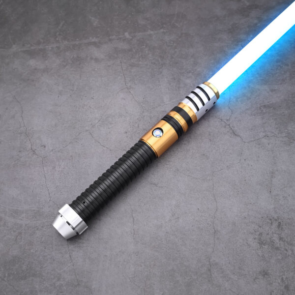 Gold and silver saber hilt with black ribbed grip, ignited with a blue blade on a concrete surface.