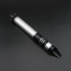 Silver-accent Crusader saber hilt laying on a dark surface, blade not attached.
