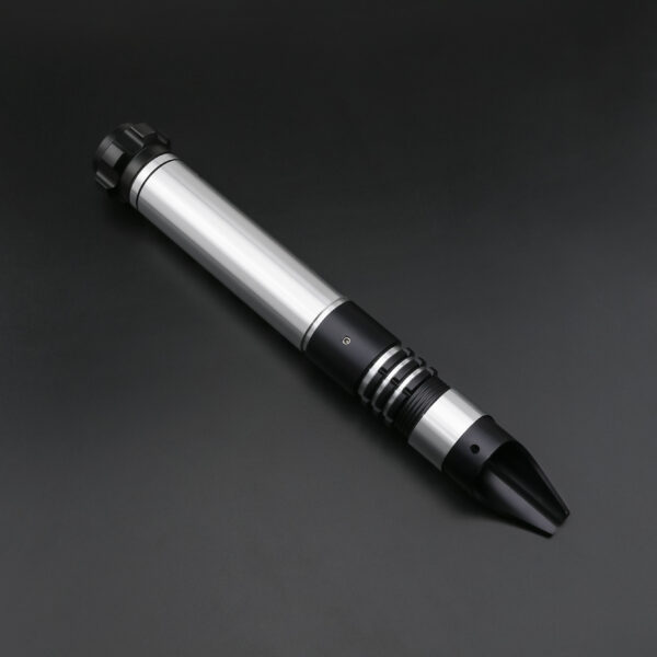 Silver-accent Crusader saber hilt laying on a dark surface, blade not attached.