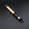 Gold-accent Crusader saber hilt laying on a dark surface, shown without the blade installed.