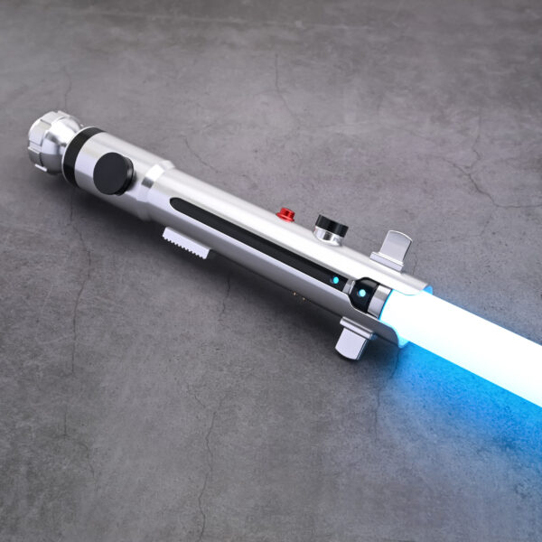 Studio mockup of the silver Snips CW shoto saber hilt, highlighting its minimalist profile, black buttons, and blue blade ignition, set against a dark futuristic background with a blue monkey mascot icon.
