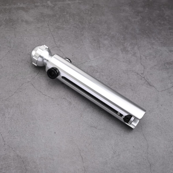 Detailed silver Snips CW primary saber hilt showing the control box with red and black switches, a textured silver grip, and a gear-style pommel on a concrete background.